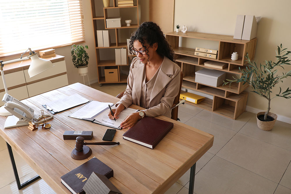 Female African-American notary working in office