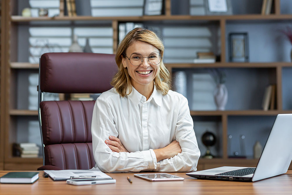 older female notary sitting at desk