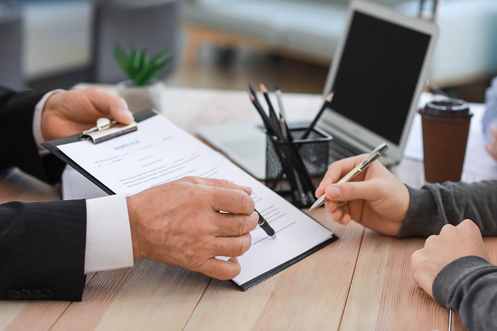 Man signing documents at notary public office