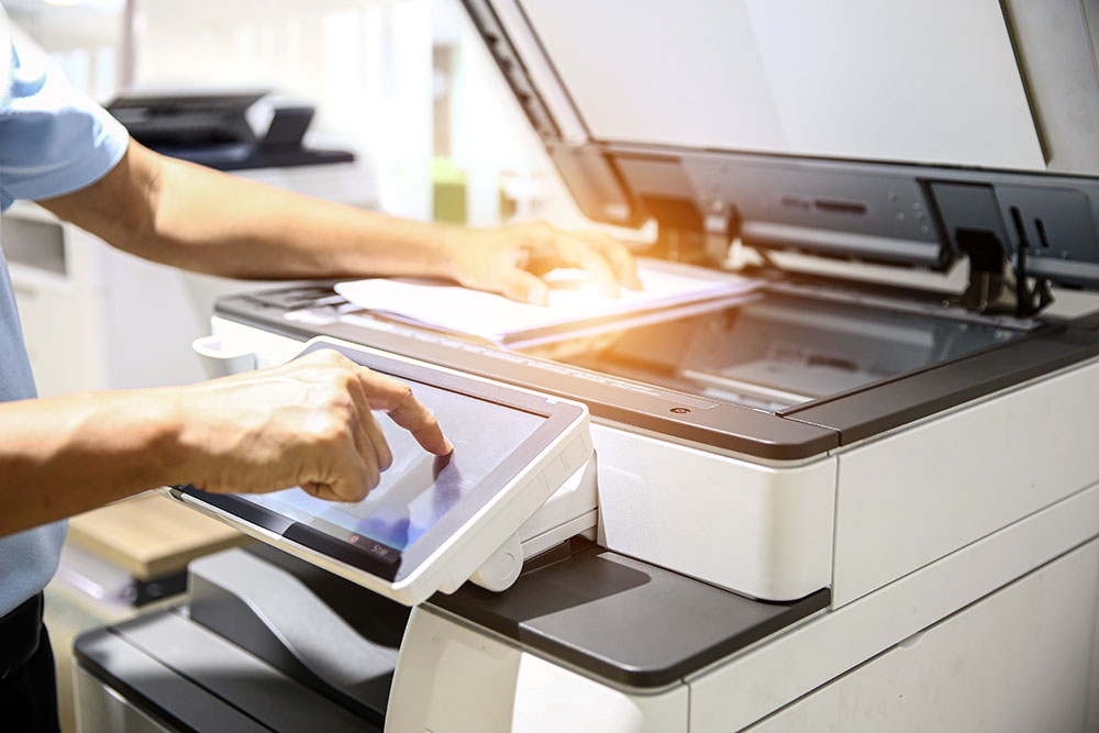 Hand use copier or photocopier or photocopy machine office equipment workplace for scanner or scanning document or printer for printing paperwork hard copy duplicate Xerox service maintenance repair.