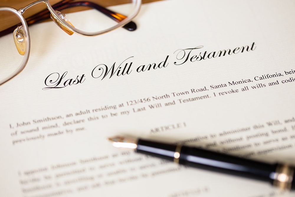 Last will and testament with pen and glasses concept for legal document