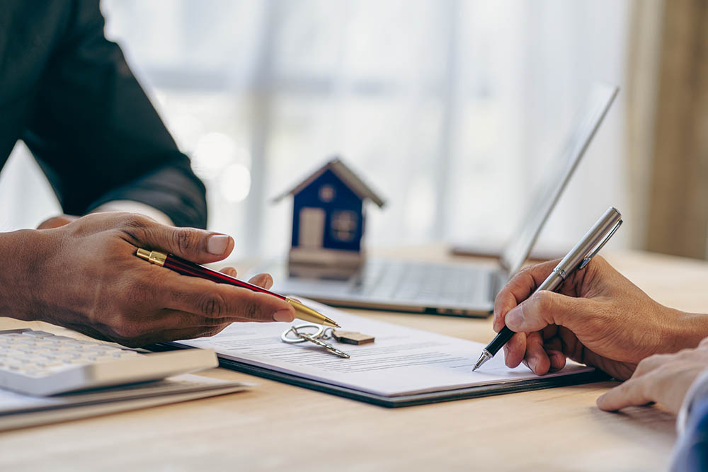 Loan officers recommend homes to clients after signing a real estate agreement.