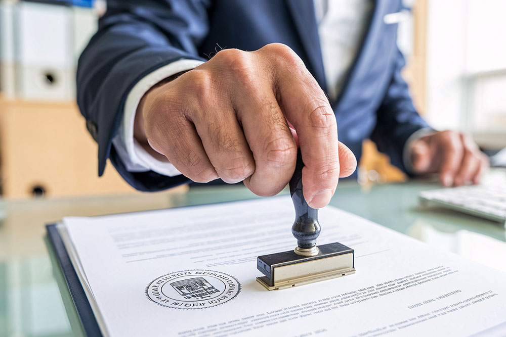a notary public stamping a document