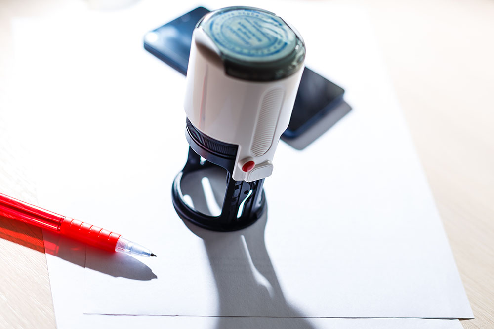 notary public stamp on a stack of papers