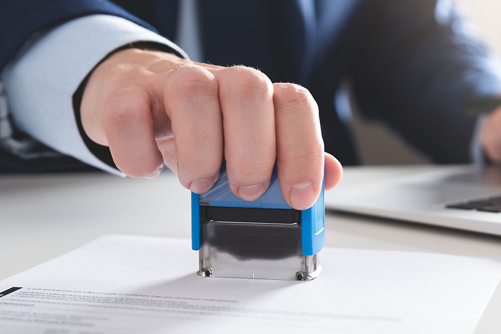 notary working in office with stamp