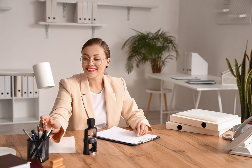 female notary public working in office