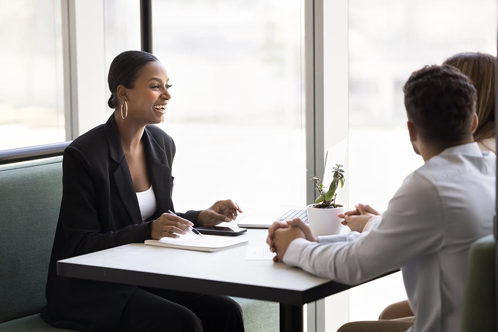 african woman leads will signing process for couple