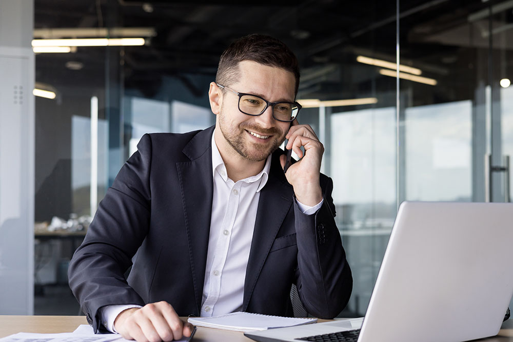 smiling notary on the phone