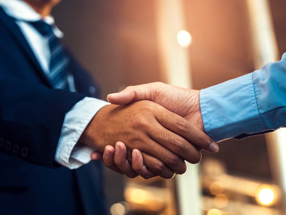business persons shaking hands